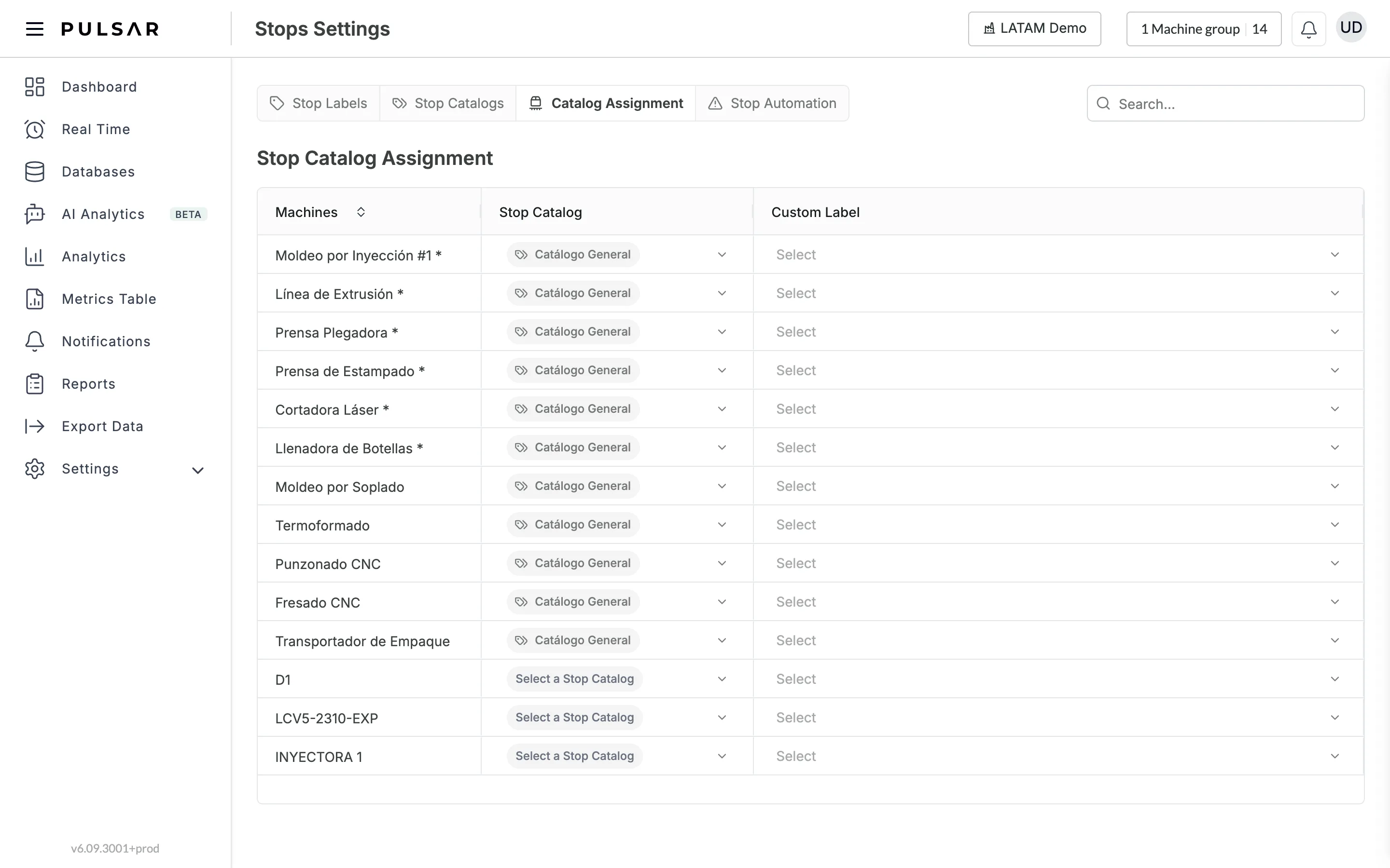 Settings > Stops, Catalog Assignment tab: the Stop Catalog Assignment table with the Machines, Stop Catalog and Custom Label columns, and a Select drop-down for each machine in the Custom Label column.